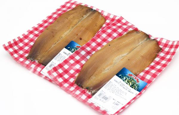 Cold smoked herring fillet in a vacuum packaging